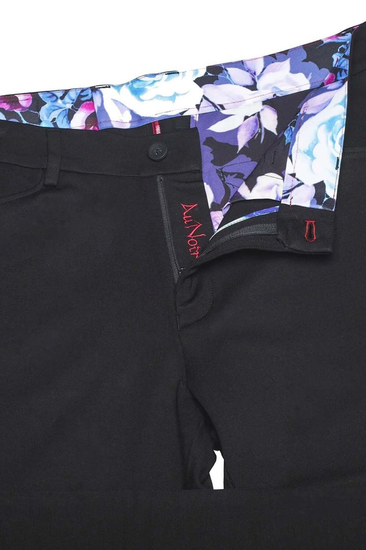 Pantalon de style Magnum avec ceinture à motif floral et coupe ajustée, idéal pour un look moderne.