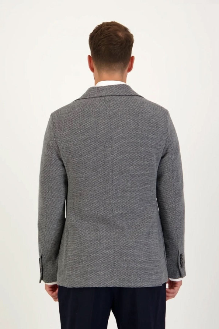 Blazer en jersey de coton gris texturé de dos, style formel et décontracté par Circolo 1901, idéal pour diverses occasions.