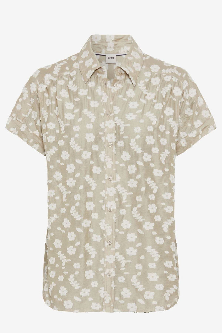 Blouse VIV en broderie florale beige, silhouette oversize, boutons élégants pour l'été.