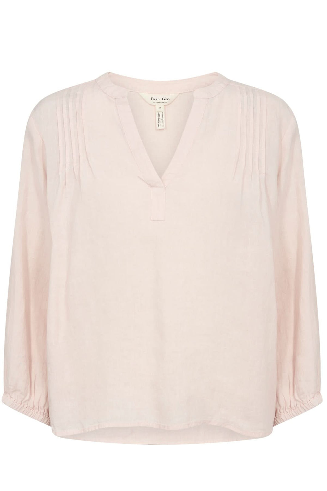 Blouse en lin Nyara coloris rose clair avec décolleté en V et manches 3/4 élastiques.