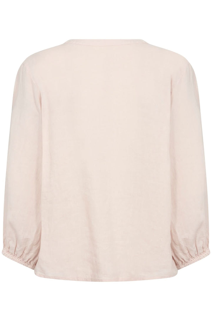 Blouse en lin Nyara de couleur rose, dos droit avec manches 3/4 élastiques, coupe légère et aérée.