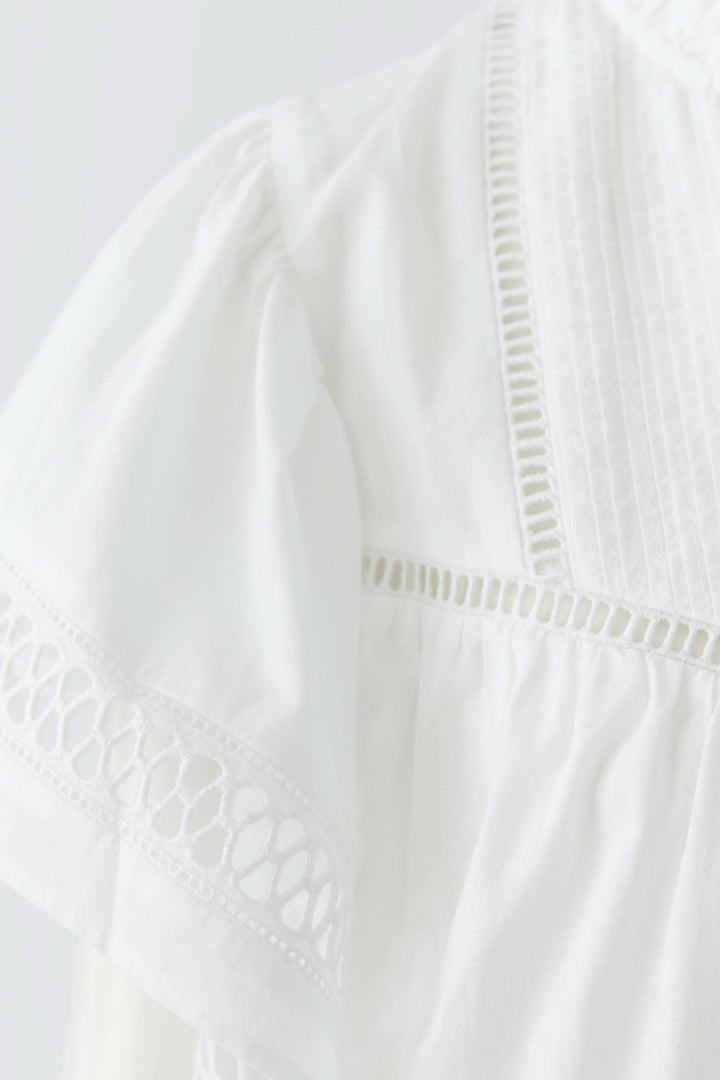Flowy blouse with openwork details
