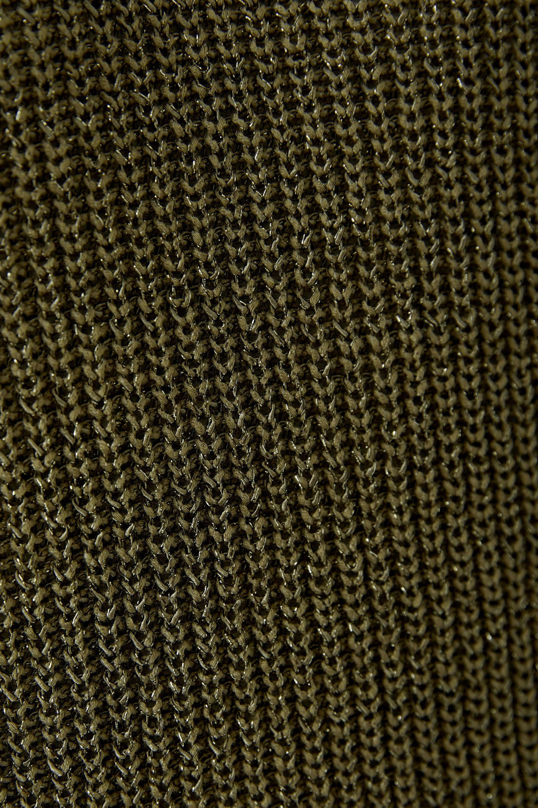Texture de maille de la camisole tricoté en fil spécial, détaillant le motif texturé.