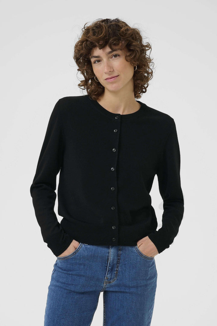 Cardigan Noelani noir à encolure ronde, tricoté en laine douce avec boutons sur le devant.