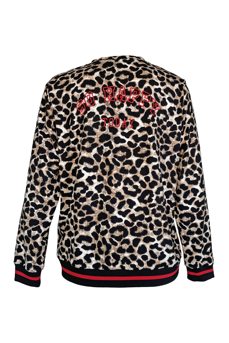 Chandail imprimé léopard avec finitions contrastantes et motif animalier moderne. Décris moi le produit en français.