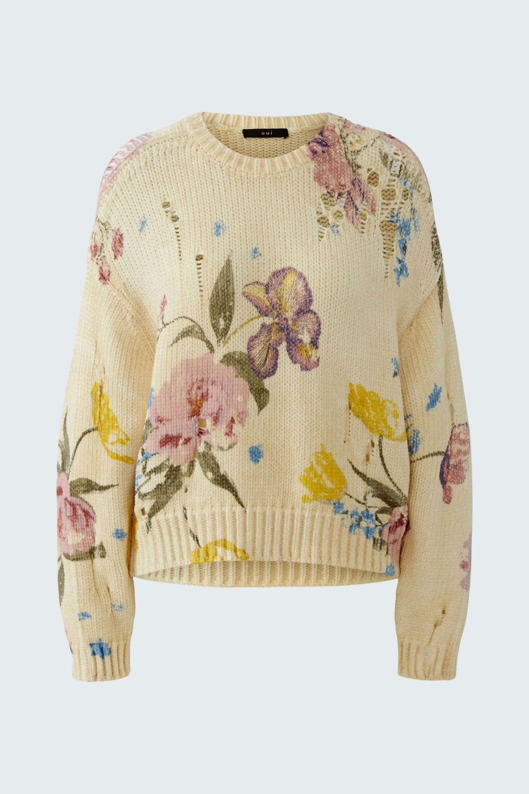 Chandail vintage tendance avec imprimé floral, coupe décontractée et détails ajourés, idéal pour un look expressif en maille.