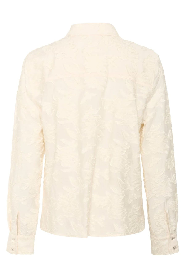 Chemise Vilya à relief floral ton sur ton avec manches longues et col classique, vue arrière détaillant le motif floral délicat.