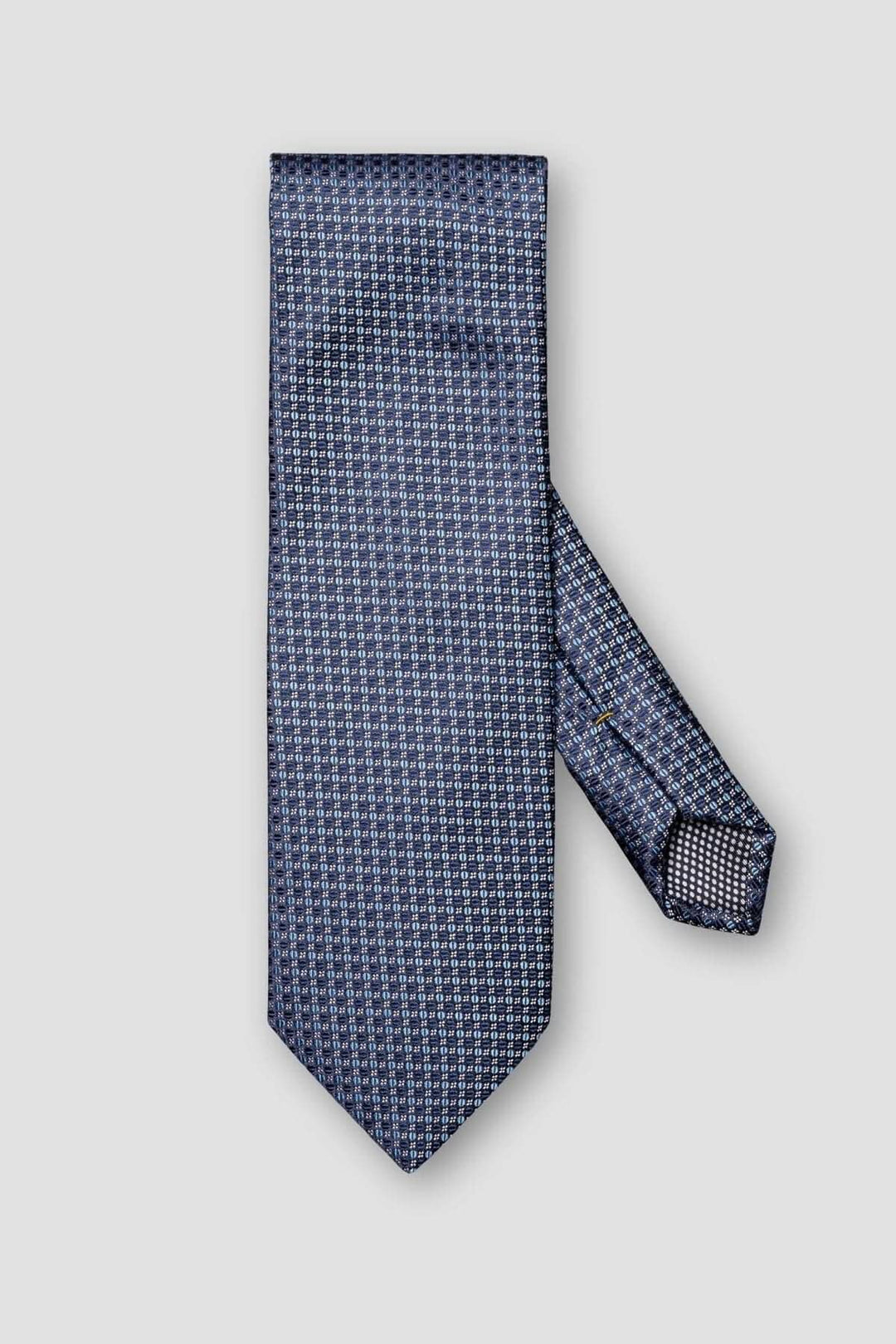 Cravate en soie bleu marine avec motif circulaire élégant, parfaite pour les occasions formelles.