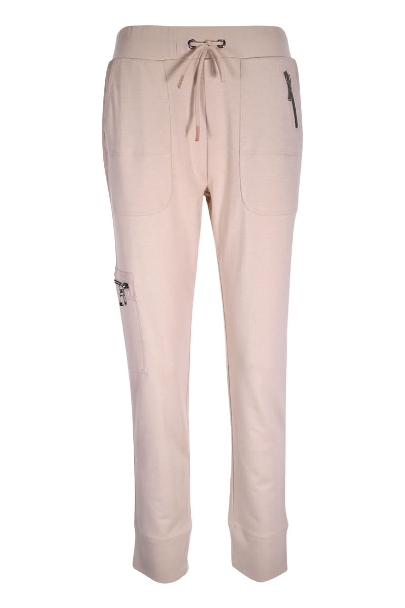 Jogging ajusté, pantalon utilitaire beige avec coupe ajustée, taille élastique et poches zippées, confort et style pour le quotidien.