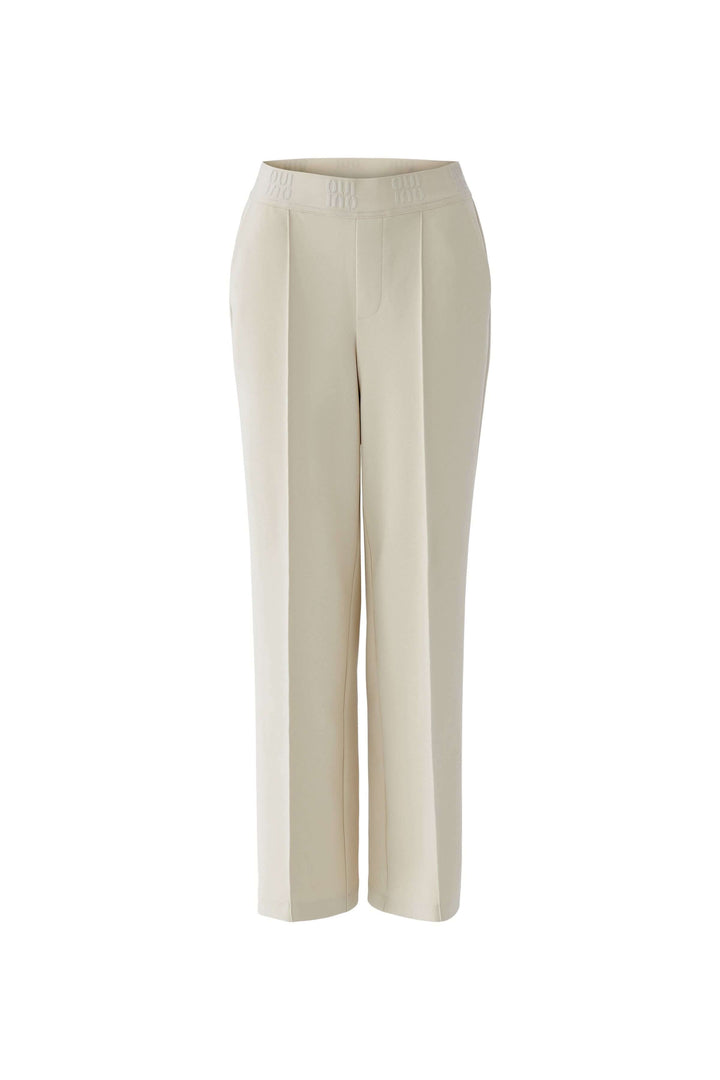 Pantalon droit à taille élastique logo avec plis marqués, poches latérales et coupe droite, idéal pour une silhouette moderne.