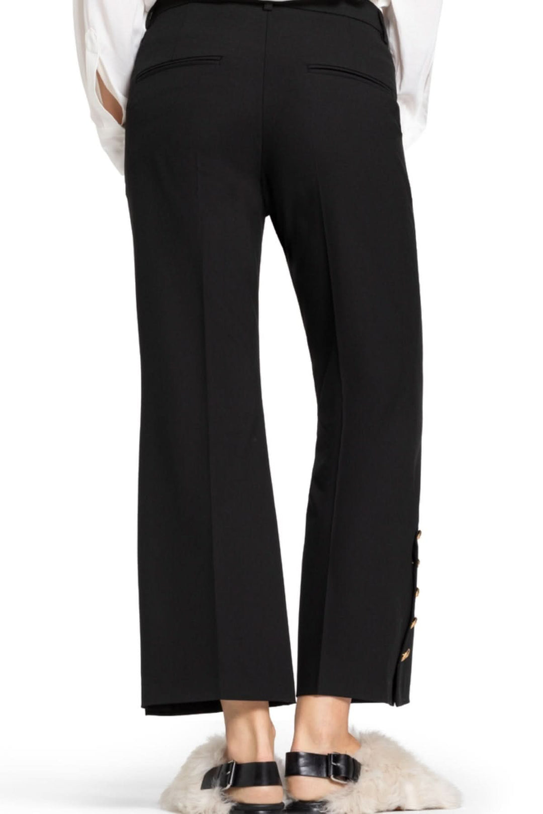 Pantalon élégant à coupe droite avec boutons dorés, confort et allure raffinée, parfait pour le bureau ou occasions spéciales.