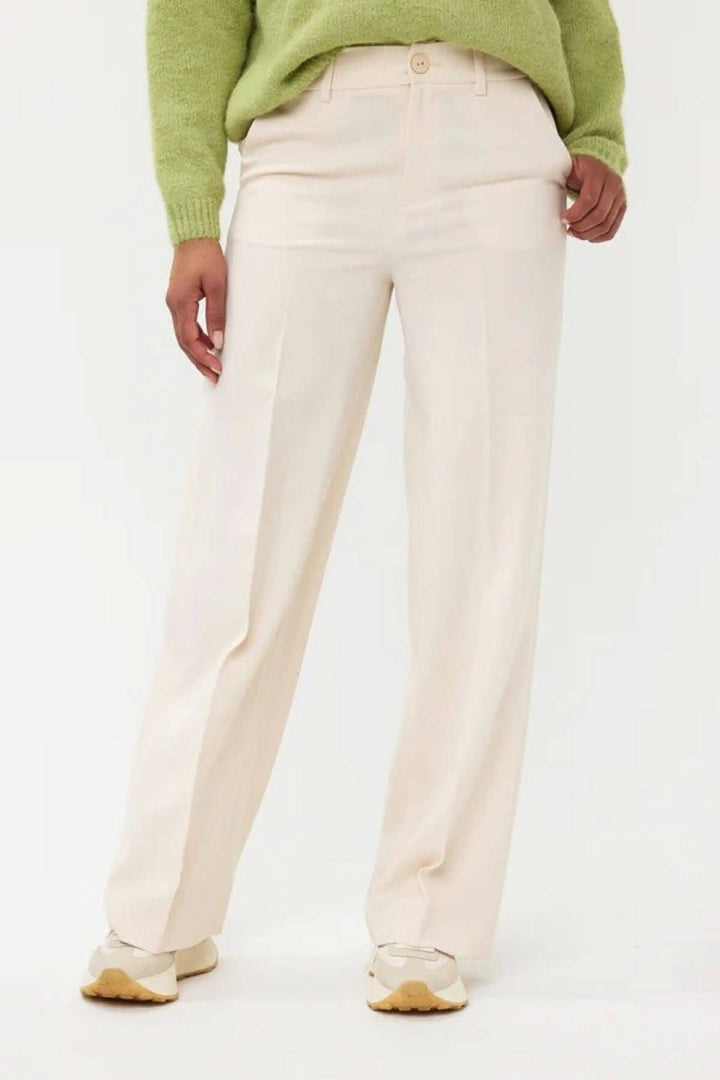 Pantalon taille haute en polyester avec jambes larges, beige, confort décontracté, taille avec bouton et poches.