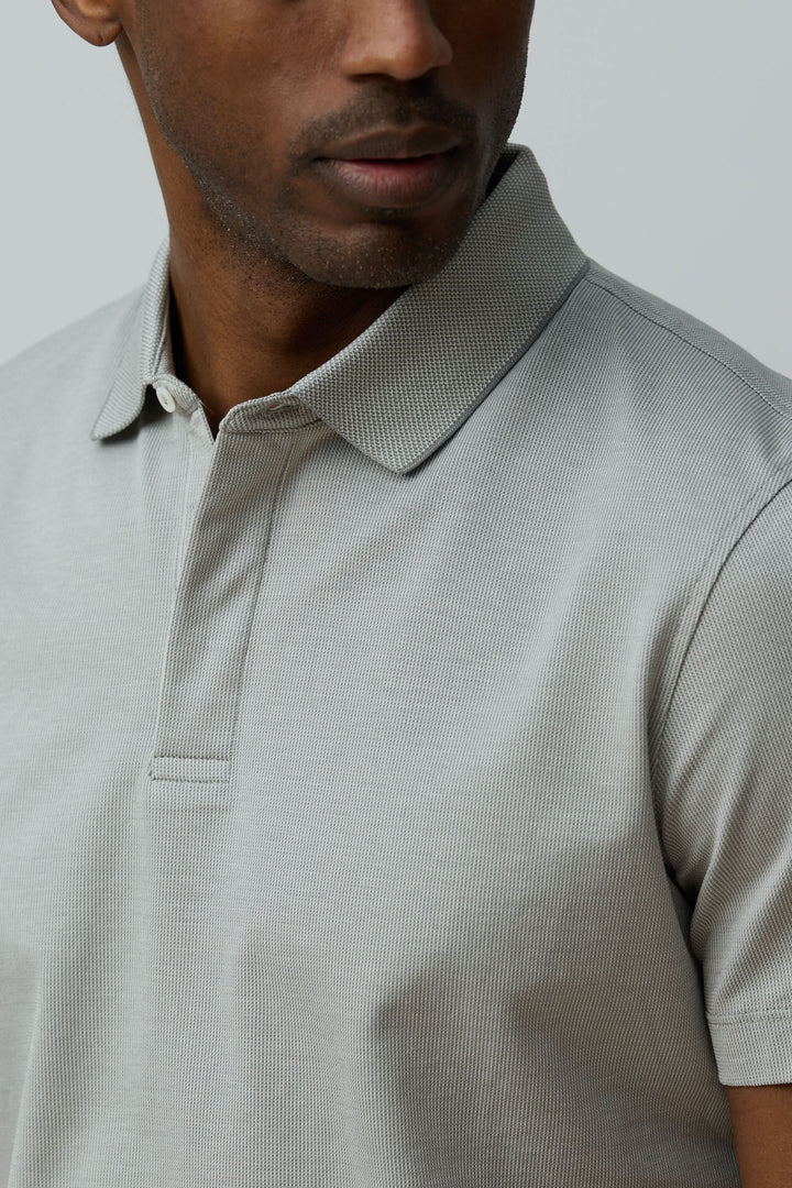 Polo en coton Corneliani ajusté, élégant et confortable avec maille fine texturée, col classique et manches courtes.