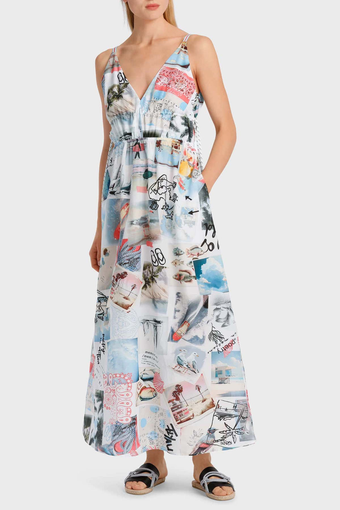 Robe à bretelles avec imprimés variés, encolure en V, jupe longue et fentes, style décontracté et estival.