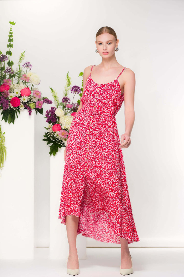 Robe fleurie mi-longue à imprimé délicat avec fines bretelles et encolure douce, idéale pour un look estival chic.