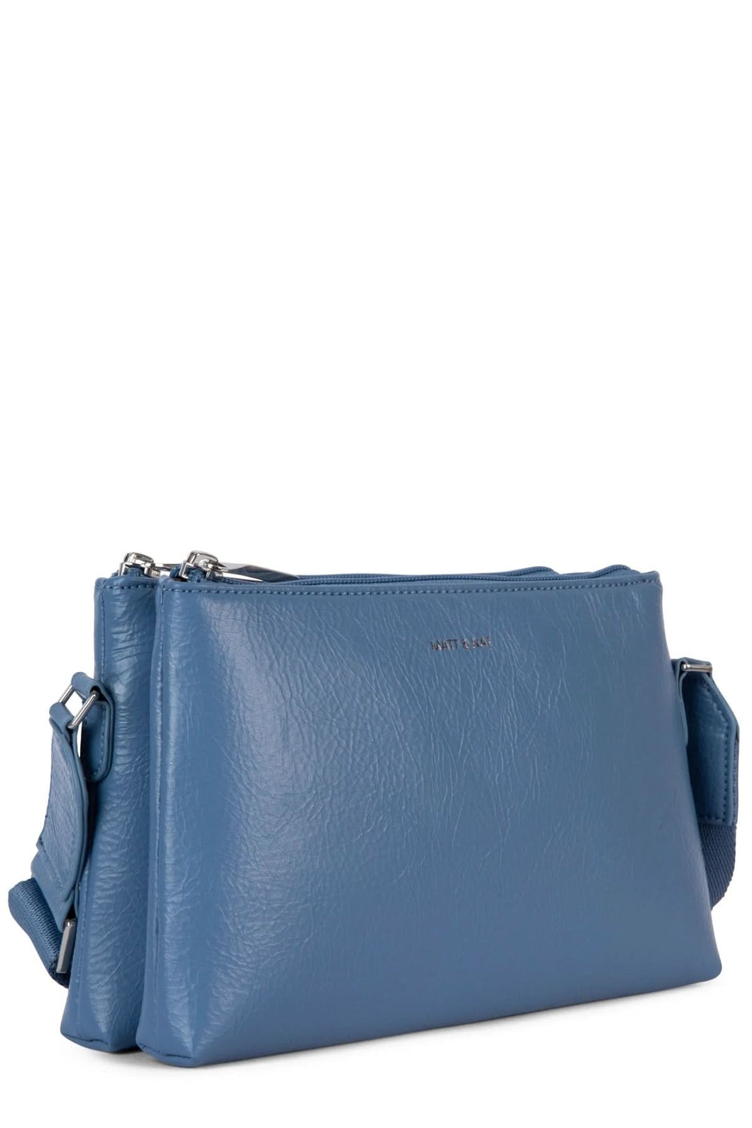 Sac à mains Indie bleu en cuir, avec deux compartiments zippés et bretelle ajustable pour un port confortable.