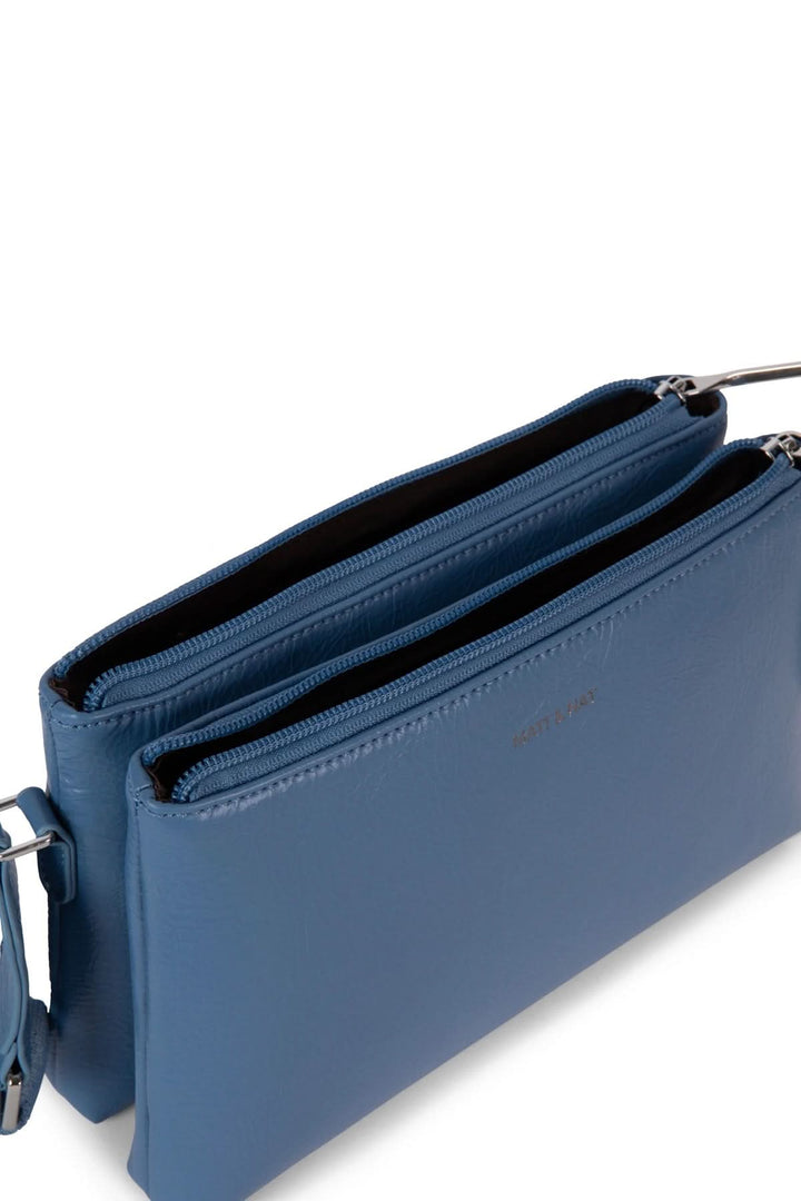 Sac à mains Indie bleu avec deux compartiments zippés et bretelle ajustable, idéal pour l'organisation.