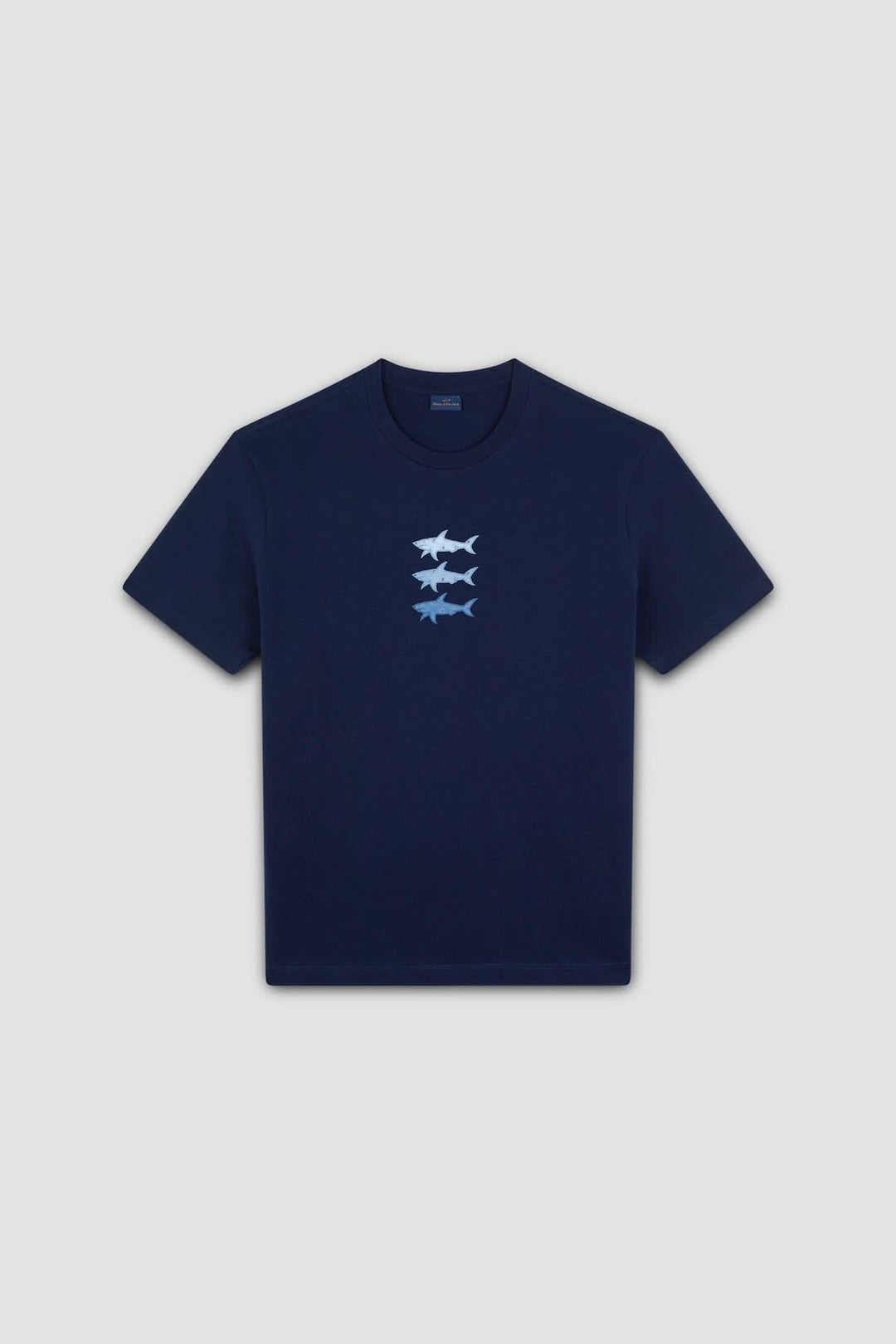 T-shirt en coton bleu marine avec imprimé de trois requins stylisés sur la poitrine.