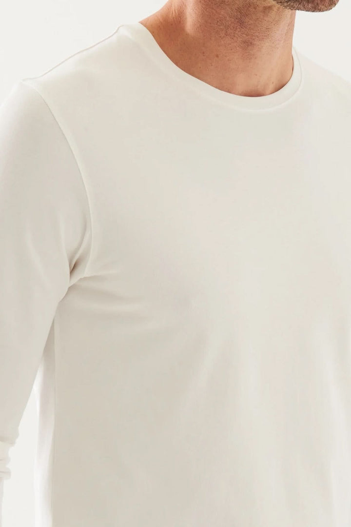 T-shirt à manches longues en coton Pima péruvien, col rond, couleur blanche, confortable et extensible.