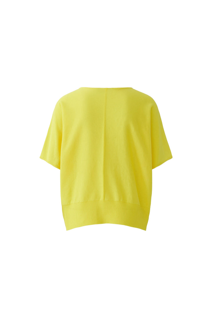 Tricot fluide à manches courtes jaune avec coupe ample, idéal pour un style décontracté.
