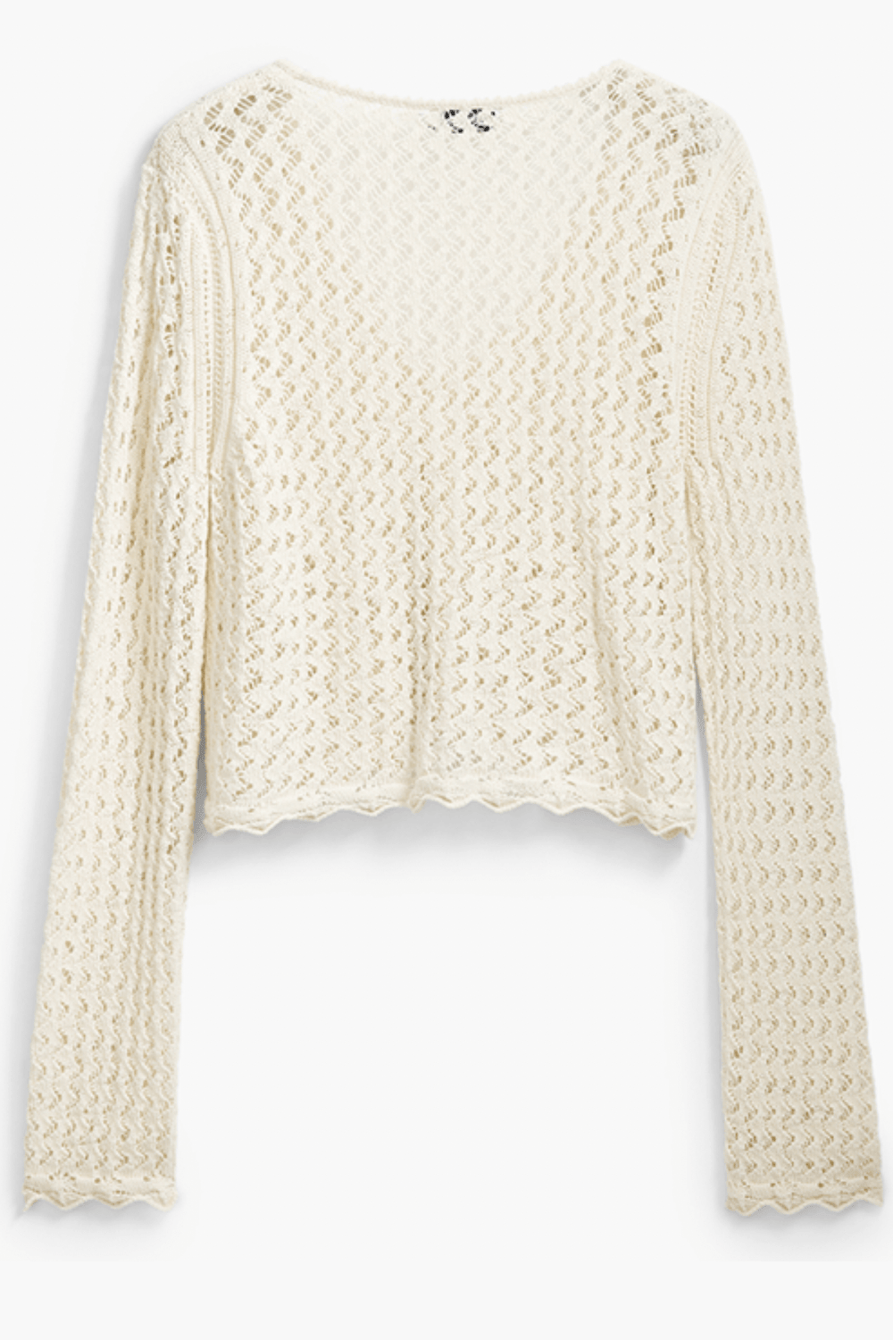 Tricot à motif ondulé, en tissu ajouré, encolure en V, manches longues, couleur crème.