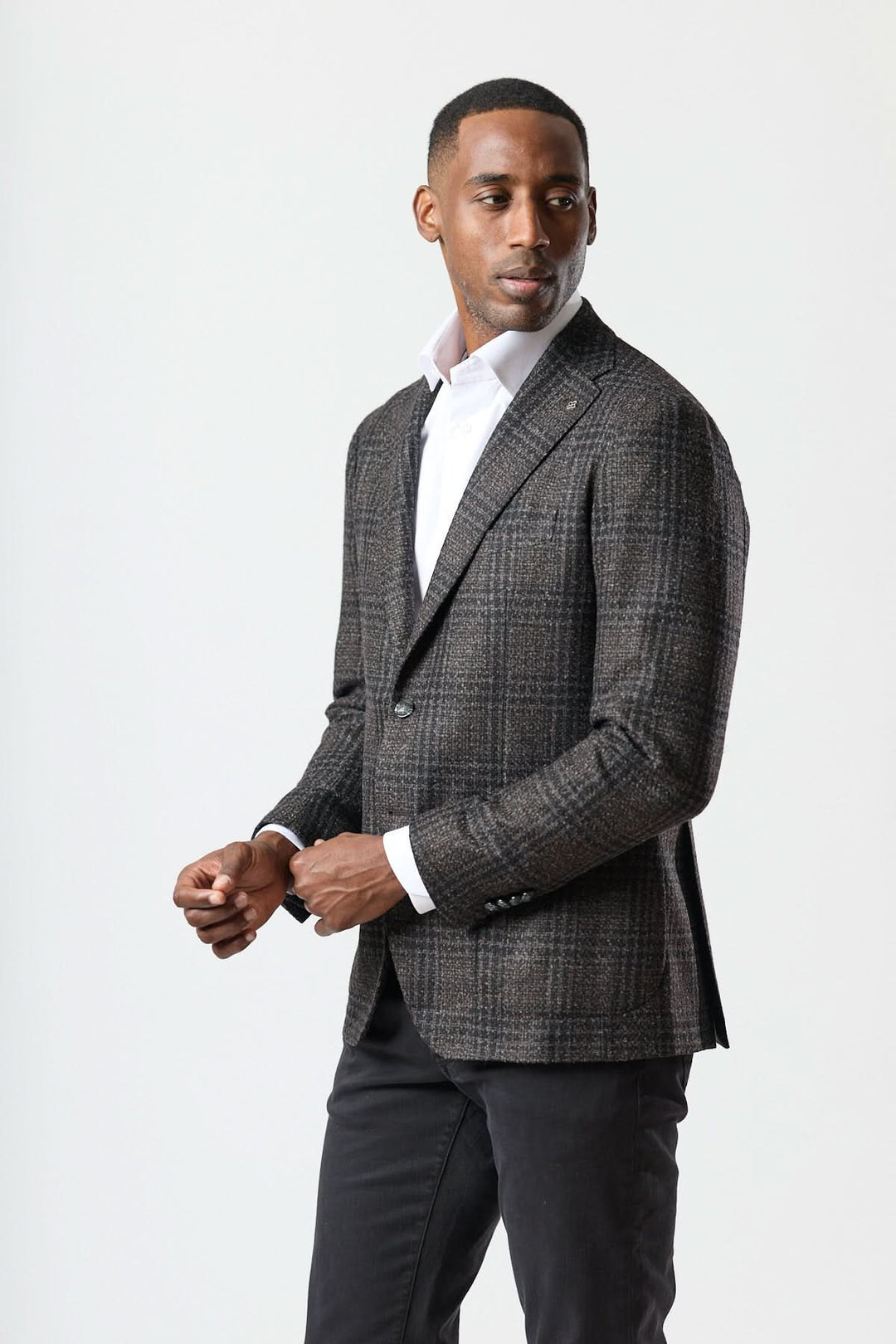 Veston à motif Prince-de-Galles moderne avec tissu texturé et coupe souple. Modèle stylé pour une allure élégante.