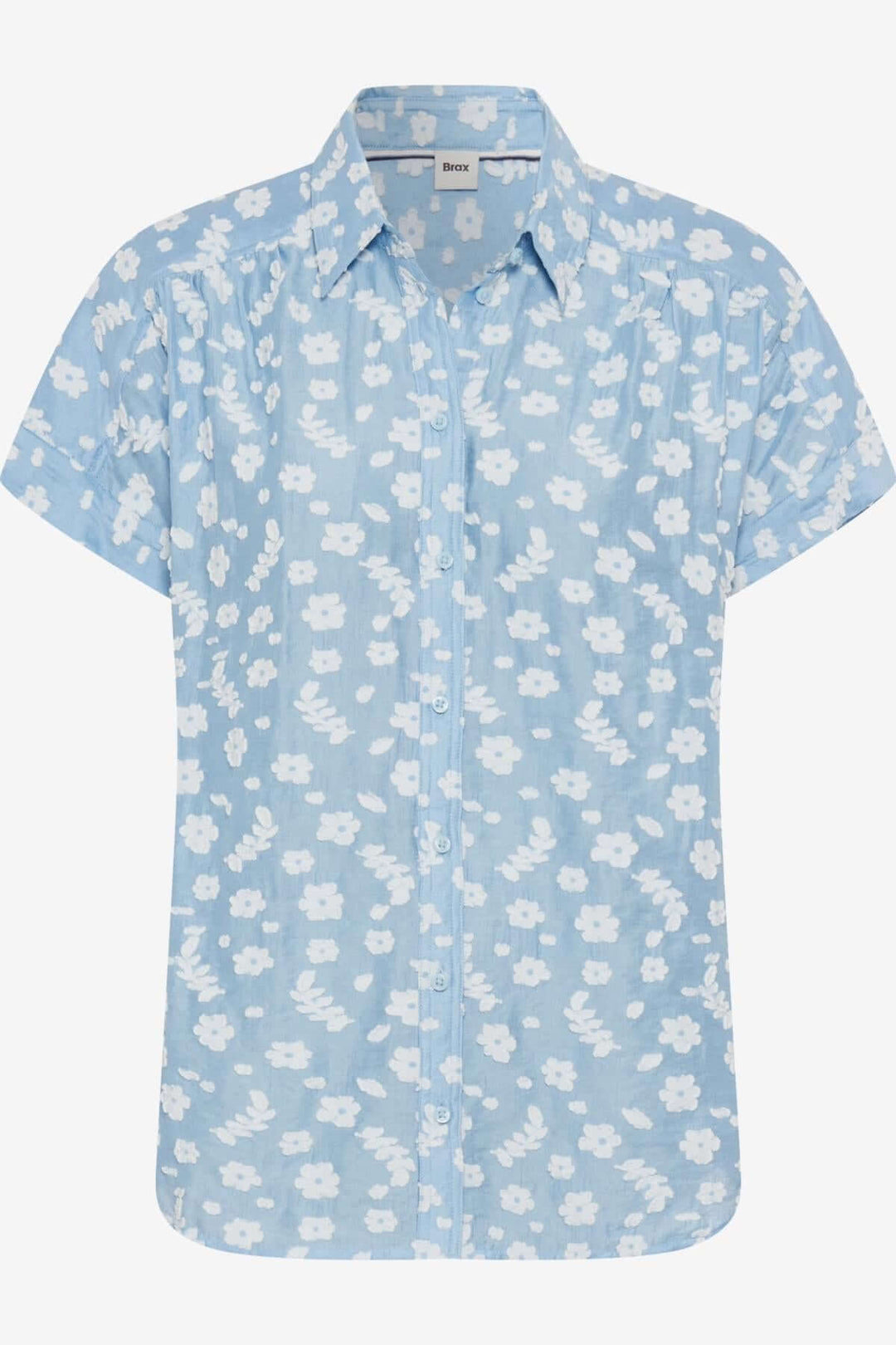 Blouse VIV légère en chambray bleu à motifs floraux blancs, idéale pour l'été et élégante avec sa coupe oversize.