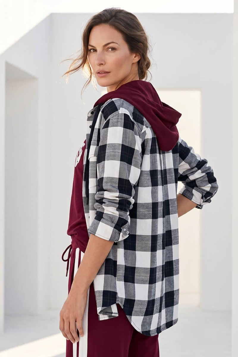 Front view of a women's Kennys plaid shirt with a hood