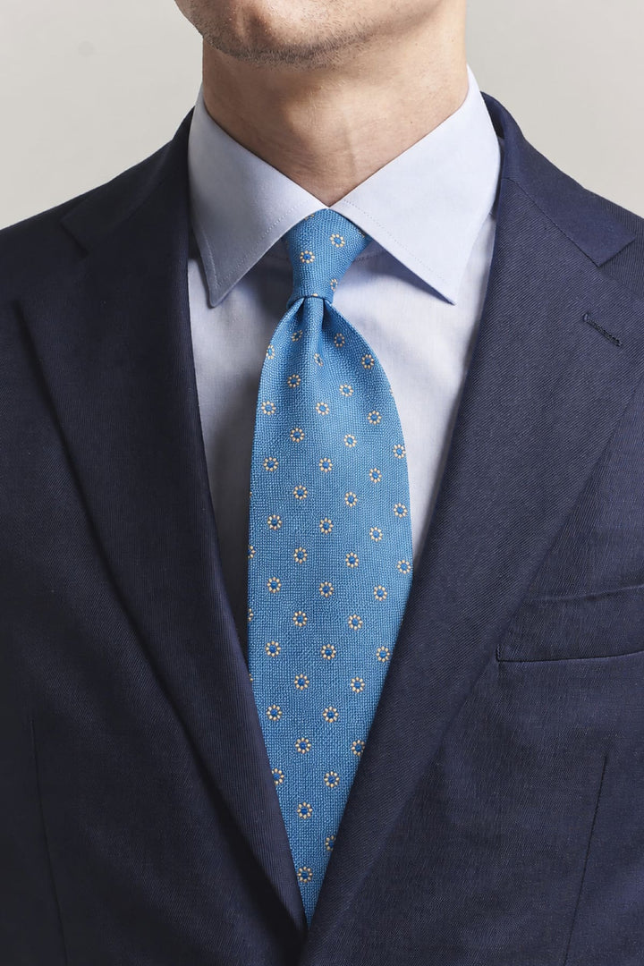 Close-up of a red Eton geometric-patterned tie for men - Valérie Simon