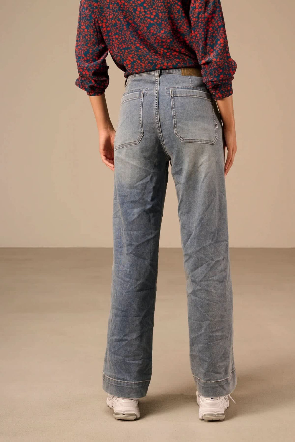 Front view of Nile women's blue high-rise straight-leg jeans with patch pockets