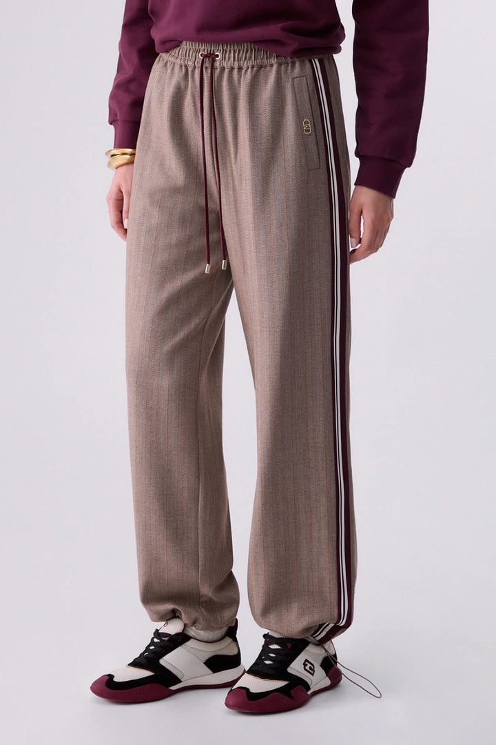 Joggers with fine stripes and side bands, front view for women liujo