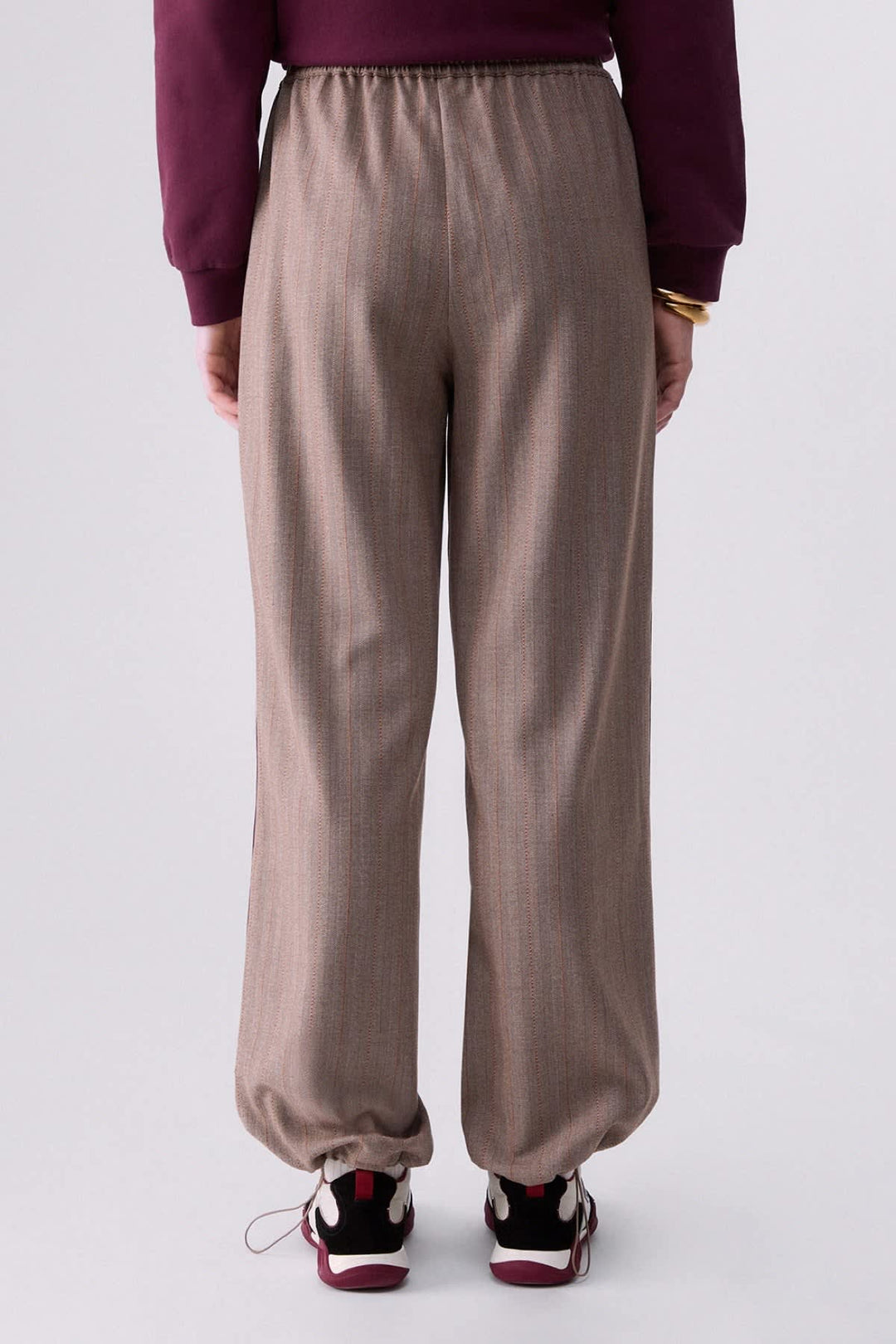 Joggers with fine stripes and side bands, front view for women liujo