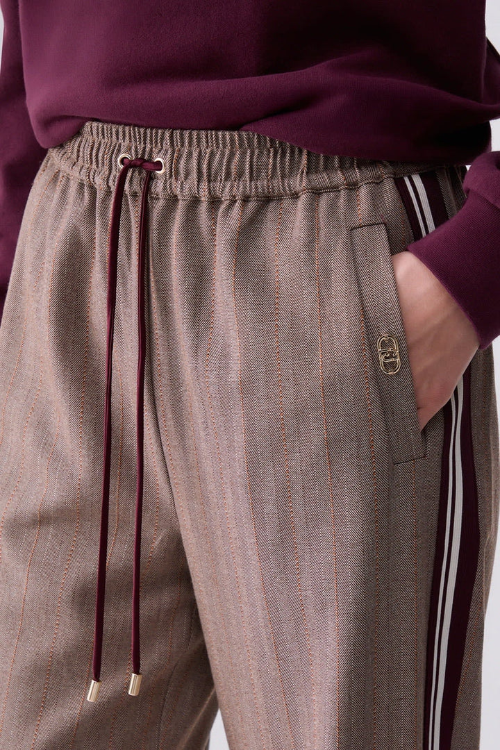 Joggers with fine stripes and side bands, front view for women liujo