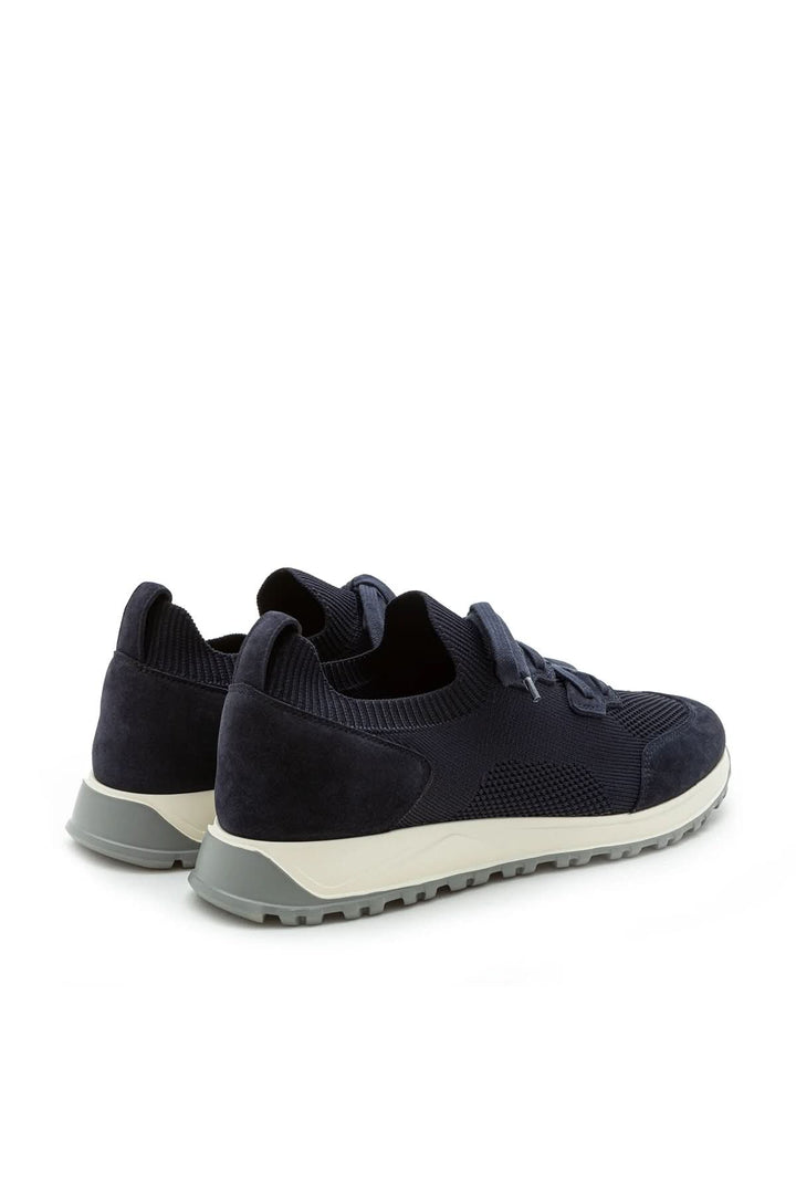 Sneaker homme cuir et tissu extensible, design élégant, semelle ultralégère, confort ultime pour un look décontracté chic.