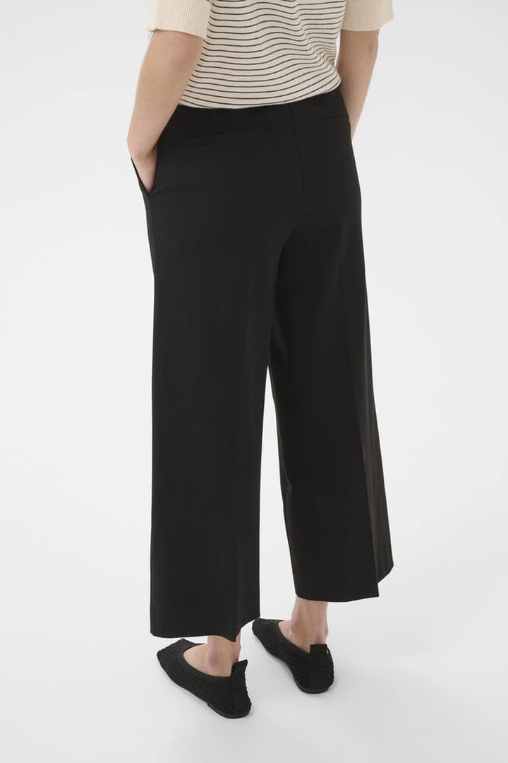 Vue de côté pantalon jambe large Conchita Part Two noir - Valérie Simon