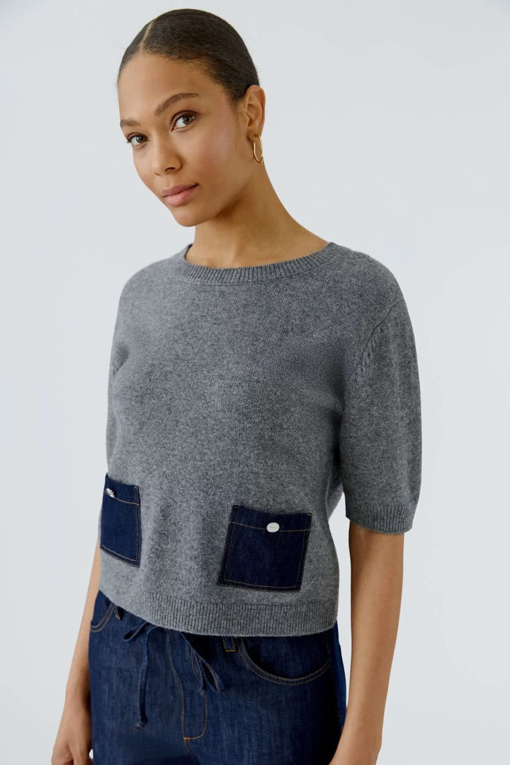Pull en denim à manches mi-longues avec poches vue de face pour femme Oui