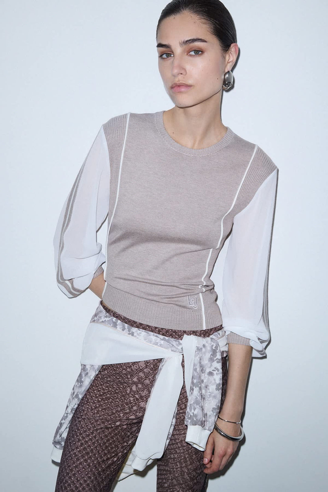 Two-material knit with contrasting sleeves, front view for women liujo
