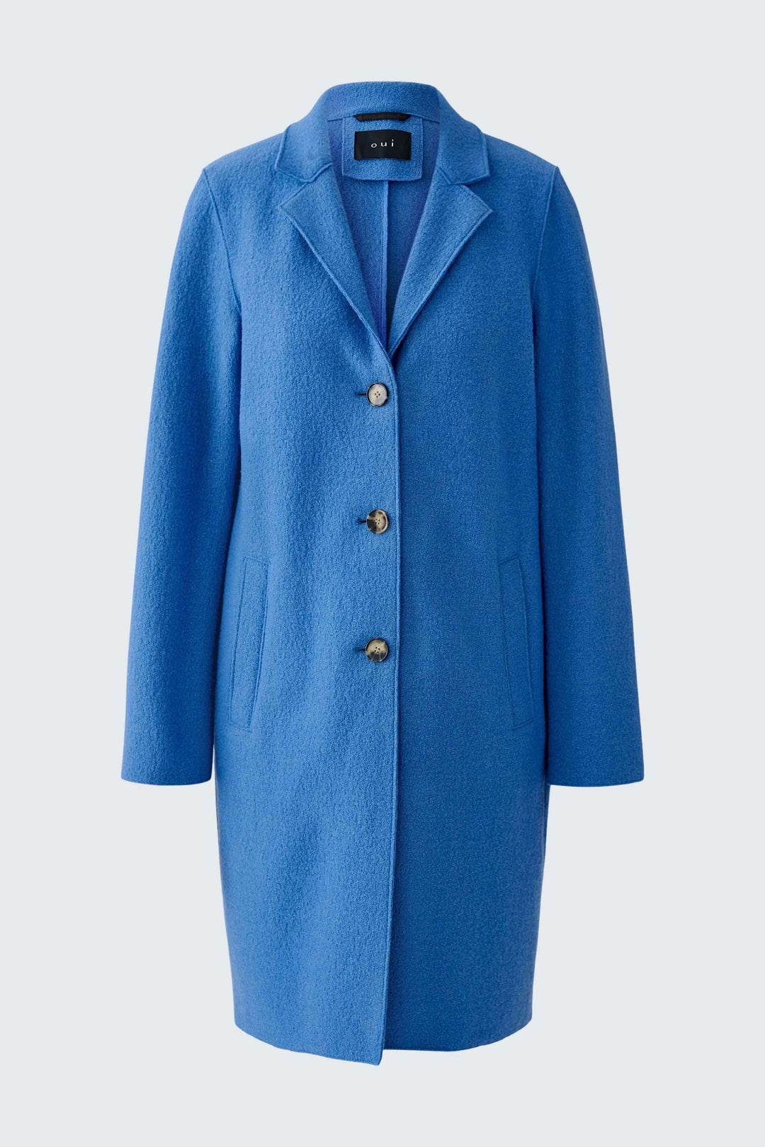 Manteau Mayson bleu à coupe droite et longue avec boutons, col tailleur classique, idéal pour la mi-saison et l&