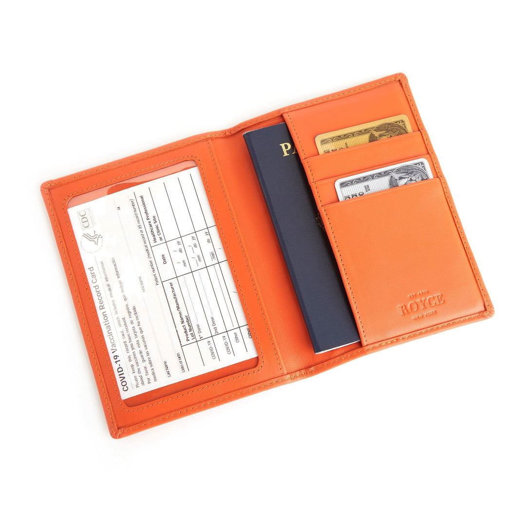 RFID blocking vaccine card passport wallet in orange, featuring a clear card holder and space for identification.